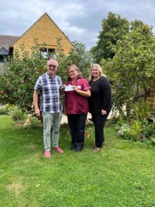 Bretforton Gardening Club present Campden Home Nursing with a cheque